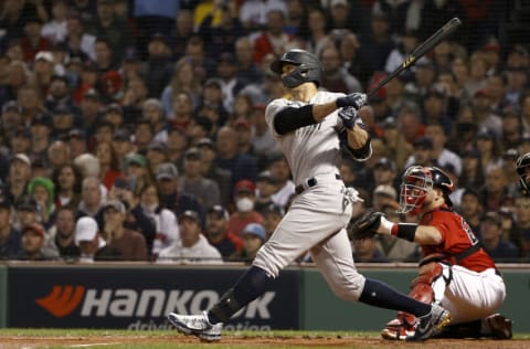 BOSTON, MASSACHUSETTS - OCTOBER 05: Giancarlo Stanton #27 of the New York Yankees watches his single off the wall against the New York Yankees during the first inning of the American League Wild Card game at Fenway Park on October 05, 2021 in Boston, Massachusetts. (Photo by Winslow Townson/Getty Images)