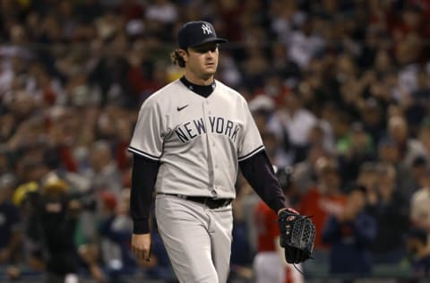 BOSTON, MASSACHUSETTS - OCTOBER 05: Gerrit Cole #45 of the New York Yankees walks to the dugout after being taken out against the Boston Red Sox during the third inning of the American League Wild Card game at Fenway Park on October 05, 2021 in Boston, Massachusetts. (Photo by Winslow Townson/Getty Images)