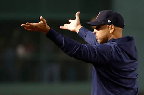 BOSTON, MASSACHUSETTS - OCTOBER 05: Manager Alex Cora #13 of the Boston Red Sox reacts after beating the New York Yankees 6-2 in the American League Wild Card game at Fenway Park on October 05, 2021 in Boston, Massachusetts. (Photo by Winslow Townson/Getty Images)