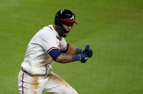 ATLANTA, GEORGIA - OCTOBER 17: Eddie Rosario #8 of the Atlanta Braves reacts after he hit a single to score the winning run against the Los Angeles Dodgers in the ninth inning of Game Two of the National League Championship Series at Truist Park on October 17, 2021 in Atlanta, Georgia. (Photo by Michael Zarrilli/Getty Images)