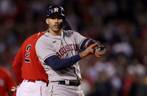 BOSTON, MASSACHUSETTS - OCTOBER 19: Carlos Correa #1 of the Houston Astros reacts after he hit a double against the Boston Red Sox in the ninth inning of Game Four of the American League Championship Series at Fenway Park on October 19, 2021 in Boston, Massachusetts. (Photo by Elsa/Getty Images)