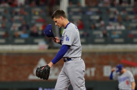 ATLANTA, GEORGIA - OCTOBER 23: Corey Seager #5 of the Los Angeles Dodgers reacts after fielding a line drive by Joc Pederson #22 of the Atlanta Braves during the second inning of Game Six of the National League Championship Series at Truist Park on October 23, 2021 in Atlanta, Georgia. (Photo by Kevin C. Cox/Getty Images)