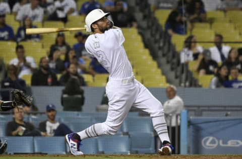 LOS ANGELES, CA - AUGUST 23: Chris Taylor #3 of the Los Angeles Dodgers at bat against the New York Yankees at Dodger Stadium on August 23, 2019 in Los Angeles, California. Teams are wearing special color schemed uniforms with players choosing nicknames to display for Players' Weekend. The Yankees won 10-2. (Photo by John McCoy/Getty Images)