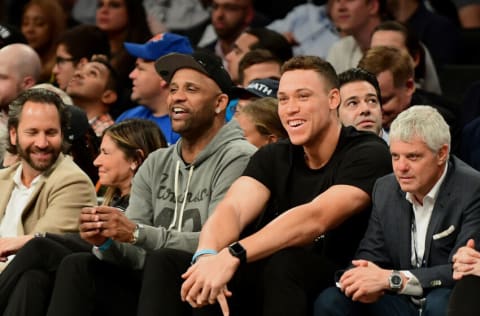 NEW YORK, NEW YORK - OCTOBER 25: CC Sabathia and Aaron Judge of the New York Yankees watch the Brooklyn Nets and New York Knicks game at Barclays Center on October 25, 2019 in the Brooklyn borough of New York City. NOTE TO USER: User expressly acknowledges and agrees that, by downloading and or using this photograph, User is consenting to the terms and conditions of the Getty Images License Agreement. (Photo by Emilee Chinn/Getty Images)