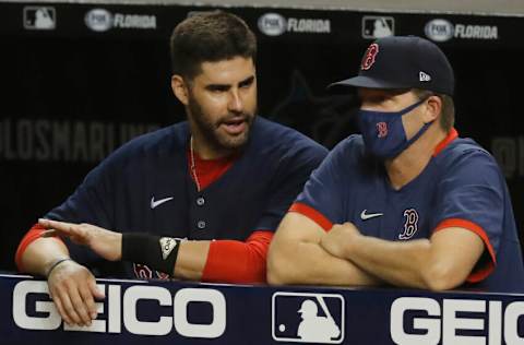 MIAMI, FLORIDA - SEPTEMBER 15: J.D. Martinez #28 of the Boston Red Sox talks with hitting coach Tim Hyers #51 against the Miami Marlins at Marlins Park on September 15, 2020 in Miami, Florida. (Photo by Michael Reaves/Getty Images)