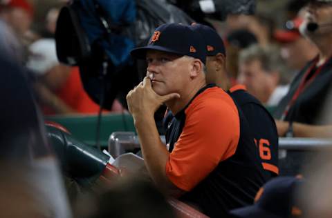 CINCINNATI, OHIO - SEPTEMBER 04: A.J. Hinch #14 of the Detroit Tigers watches his team from the dugout in the game against the Cincinnati Reds at Great American Ball Park on September 04, 2021 in Cincinnati, Ohio. (Photo by Justin Casterline/Getty Images)