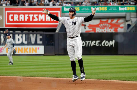 NEW YORK, NEW YORK - OCTOBER 03: Aaron Judge #99 of the New York Yankees celebrates after hitting a walk-off single in the bottom of the ninth inning to beat the Tampa Bay Rays, 1-0, clinching an American League Wild Card spot at Yankee Stadium on October 03, 2021 in New York City. (Photo by New York Yankees/Getty Images)