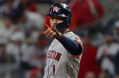 ATLANTA, GEORGIA - OCTOBER 31: Carlos Correa #1 of the Houston Astros reacts after hitting a single against the Atlanta Braves during the fifth inning in Game Five of the World Series at Truist Park on October 31, 2021 in Atlanta, Georgia. (Photo by Kevin C. Cox/Getty Images)