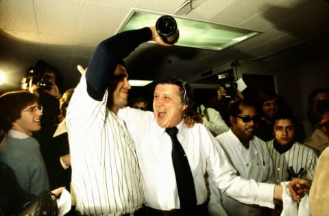 NEW YORK, NY - OCTOBER 18: New York Yankee pitcher, Mike Torrez, pours champagne over Yankee owner, George Steinbrenner, in the Yankee locker room following their 8-4 World Series victory over the Los Angeles Dodgers in the 6th game of the 1977 World Series. This was the 21st World Series victory for the NY Yankees and the first for George Steinbrenner. Torrez pitched two complete games in the 1977 World Series. (Photo by Ross Lewis/Getty Images)