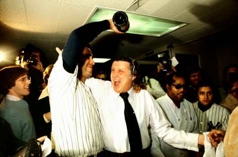 NEW YORK, NY - OCTOBER 18: New York Yankee pitcher, Mike Torrez, pours champagne over Yankee owner, George Steinbrenner, in the Yankee locker room following their 8-4 World Series victory over the Los Angeles Dodgers in the 6th game of the 1977 World Series. This was the 21st World Series victory for the NY Yankees and the first for George Steinbrenner. Torrez pitched two complete games in the 1977 World Series. (Photo by Ross Lewis/Getty Images)