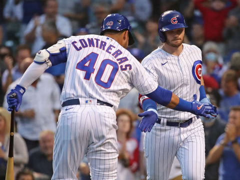 CHICAGO, ILLINOIS – SEPTEMBER 08: Ian Happ #8 of the Chicago Cubs is congratulated by Willson Contreras #40 after hitting a solo home run in the 1st inning against the Cincinnati Reds at Wrigley Field on September 08, 2021 in Chicago, Illinois. (Photo by Jonathan Daniel/Getty Images)