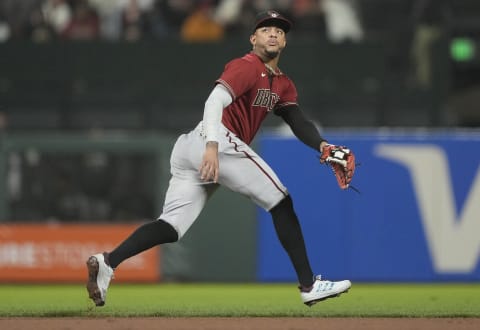 SAN FRANCISCO, CALIFORNIA – SEPTEMBER 29: Ketel Marte #4 of the Arizona Diamondbacks reacts to the ball off the bat of Mike Yastrzemski #5 of the San Francisco Giants in the bottom of the eighth inning at Oracle Park on September 29, 2021 in San Francisco, California. (Photo by Thearon W. Henderson/Getty Images)