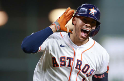 HOUSTON, TEXAS - OCTOBER 15: Carlos Correa #1 of the Houston Astros reacts to hitting a solo home run during the seventh inning against the Boston Red Sox during Game One of the American League Championship Series at Minute Maid Park on October 15, 2021 in Houston, Texas. (Photo by Carmen Mandato/Getty Images)