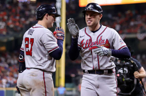 HOUSTON, TEXAS - NOVEMBER 02: Freddie Freeman #5 of the Atlanta Braves celebrates with Austin Riley #27 after hitting a solo home run against the Houston Astros during the seventh inning in Game Six of the World Series at Minute Maid Park on November 02, 2021 in Houston, Texas. (Photo by Carmen Mandato/Getty Images)