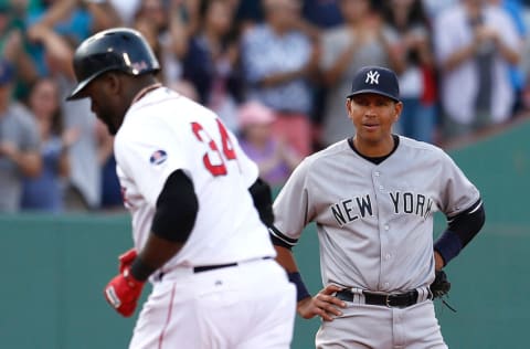 BOSTON, MA - AUGUST 17: Alex Rodriguez #13 of the New York Yankees watches as David Ortiz #34 of the Boston Red Sox rounds the bases after hitting a home run in the 7th inning at Fenway Park on August 17, 2013 in Boston, Massachusetts. (Photo by Jim Rogash/Getty Images)