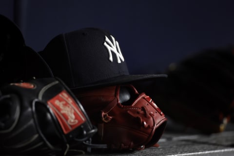 A New York Yankees baseball hat (Photo by Adam Hunger/Getty Images)