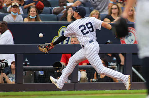 NEW YORK, NEW YORK - OCTOBER 03: Gio Urshela #29 of the New York Yankees catches a pop foul off the bat of Austin Meadows #17 of the Tampa Bay Rays in the top of the sixth inning at Yankee Stadium on October 03, 2021 in New York City. (Photo by Mike Stobe/Getty Images)