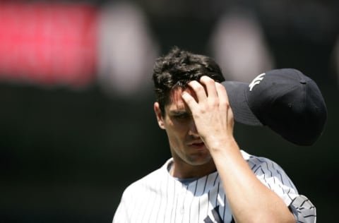 NEW YORK - JUNE 22: Carl Pavano #45 of the New York Yankees scratches his forehead against the Tampa Bay Devil Rays on June 22, 2005 at Yankee Stadium in the Bronx, New York. The Devil Rays won 5-3. (Photo by Al Bello/Getty Images)