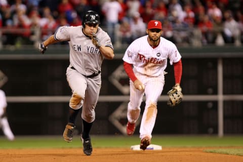 Johnny Damon #18 (L) of the New York Yankees (Photo by Al Bello/Getty Images)