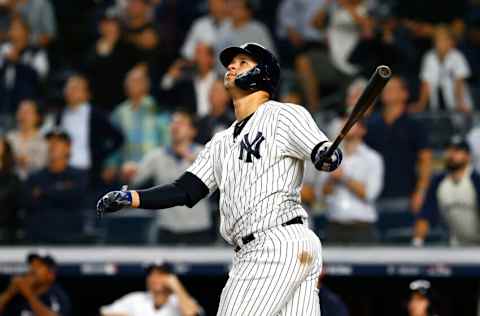 NEW YORK, NEW YORK - OCTOBER 09: Gary Sanchez #24 of the New York Yankees hits a sac fly to score Didi Gregorius #18 against Craig Kimbrel #46 of the Boston Red Sox during the ninth inning in Game Four of the American League Division Series at Yankee Stadium on October 09, 2018 in the Bronx borough of New York City. (Photo by Mike Stobe/Getty Images)