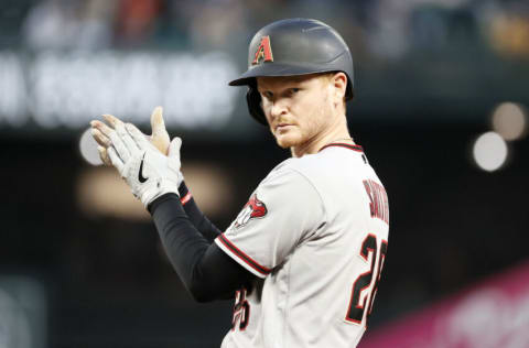 SEATTLE, WASHINGTON - SEPTEMBER 11: Pavin Smith #26 of the Arizona Diamondbacks reacts after his RBI single against the Seattle Mariners during the fourth inning at T-Mobile Park on September 11, 2021 in Seattle, Washington. (Photo by Steph Chambers/Getty Images)