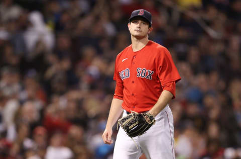 BOSTON, MASSACHUSETTS - OCTOBER 10: Garrett Whitlock #72 of the Boston Red Sox walks to the dugout after pitching in the eighth inning against the Tampa Bay Rays during Game 3 of the American League Division Series at Fenway Park on October 10, 2021 in Boston, Massachusetts. (Photo by Maddie Meyer/Getty Images)