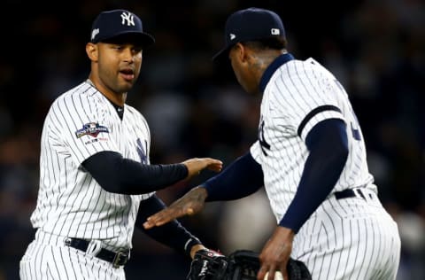 NEW YORK, NEW YORK - OCTOBER 18: Aroldis Chapman #54 and Aaron Hicks #31 of the New York Yankees celebrate after defeating the Houston Astros in game five of the American League Championship Series with a score of 4 to 1 at Yankee Stadium on October 18, 2019 in New York City. (Photo by Mike Stobe/Getty Images)