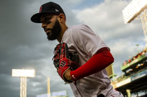 BOSTON, MA - MAY 12: Marwin Gonzalez #12 of the Boston Red Sox takes the field before a game against the Oakland Athletics on May 12, 2021 at Fenway Park in Boston, Massachusetts. (Photo by Billie Weiss/Boston Red Sox/Getty Images)