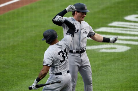 BUFFALO, NEW YORK - SEPTEMBER 07: Aaron Hicks #31 of the New York Yankees and teammate Luke Voit #59 celebrate after Voit hit a one run home run during the first inning against the Toronto Blue Jays at Sahlen Field on September 07, 2020 in Buffalo, New York. The Blue Jays are the home team and are playing their home games in Buffalo due to the Canadian government’s policy on coronavirus (COVID-19). (Photo by Bryan M. Bennett/Getty Images)