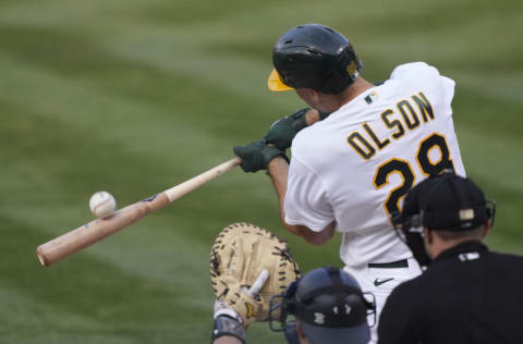 OAKLAND, CALIFORNIA - AUGUST 27: Matt Olson #28 of the Oakland Athletics swings and misses the pitch against the New York Yankees in the bottom of the first inning at RingCentral Coliseum on August 27, 2021 in Oakland, California. (Photo by Thearon W. Henderson/Getty Images)