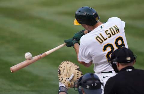 OAKLAND, CALIFORNIA - AUGUST 27: Matt Olson #28 of the Oakland Athletics swings and misses the pitch against the New York Yankees in the bottom of the first inning at RingCentral Coliseum on August 27, 2021 in Oakland, California. (Photo by Thearon W. Henderson/Getty Images)