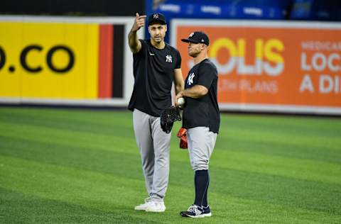 MIAMI, FL - JULY 31: Joey Gallo #13 and Brett Gardner #11 of the New York Yankees talk in the outfield during batting practice before the start of the game against the Miami Marlins at loanDepot park on July 31, 2021 in Miami, Florida. (Photo by Eric Espada/Getty Images)