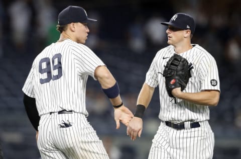 NEW YORK, NEW YORK - MAY 27: (NEW YORK DAILIES OUT) Aaron Judge #99 and DJ LeMahieu #26 of the New York Yankees in action against the Toronto Blue Jays at Yankee Stadium on May 27, 2021 in New York City. The Yankees defeated the Blue Jays 5-3. (Photo by Jim McIsaac/Getty Images)