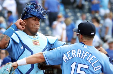 KANSAS CITY, MISSOURI - JULY 03: Whit Merrifield #15 and Salvador Perez #13 of the Kansas City Royals congratulate each other after the Royals defeated the Minnesota Twins 6-2 to win the game at Kauffman Stadium on July 03, 2021 in Kansas City, Missouri. (Photo by Jamie Squire/Getty Images)