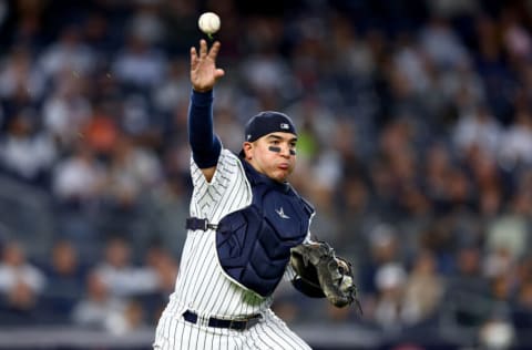 NEW YORK, NEW YORK - APRIL 22: Jose Trevino #39 of the New York Yankees throws the ball to first to get out Steven Kwan of the Cleveland Guardians to end the third inning at Yankee Stadium on April 22, 2022 in the Bronx borough of New York City. (Photo by Elsa/Getty Images)