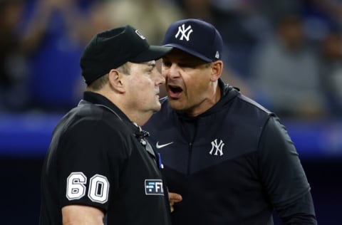 TORONTO, ON - MAY 4: Manager Aaron Boone of the New York Yankees argues with home plate umpire Marty Foster in the eighth inning during a MLB game against the Toronto Blue Jays at Rogers Centre on May 4, 2022 in Toronto, Ontario, Canada. (Photo by Vaughn Ridley/Getty Images)