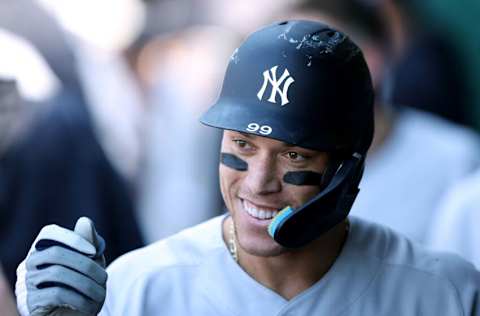 KANSAS CITY, MISSOURI - MAY 01: Aaron Judge #99 of the New York Yankees is congratulated by teammates in the dugout after hitting a solo home run during the 9th inning of the game against the Kansas City Royals at Kauffman Stadium on May 01, 2022 in Kansas City, Missouri. (Photo by Jamie Squire/Getty Images)