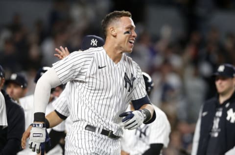 NEW YORK, NEW YORK - MAY 10: Aaron Judge #99 of the New York Yankees celebrates with his teammates after his ninth inning game winning three run home run against the Toronto Blue Jays at Yankee Stadium on May 10, 2022 in New York City. (Photo by Jim McIsaac/Getty Images)