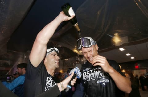 NEW YORK, NEW YORK - SEPTEMBER 19: Tyler Wade #14 and Aaron Judge #99 of the New York Yankees celebrate after the New York Yankees clinched the American League Division title with the 9-1 win over the Los Angeles Angels at Yankee Stadium on September 19, 2019 in Bronx borough of New York City. (Photo by Elsa/Getty Images)