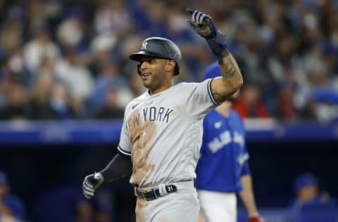 TORONTO, ON - MAY 03: Aaron Hicks #31 of the New York Yankees scores off a Aaron Judge #99 double in the seventh inning of their MLB game against the Toronto Blue Jays at Rogers Centre on May 3, 2022 in Toronto, Canada. (Photo by Cole Burston/Getty Images)