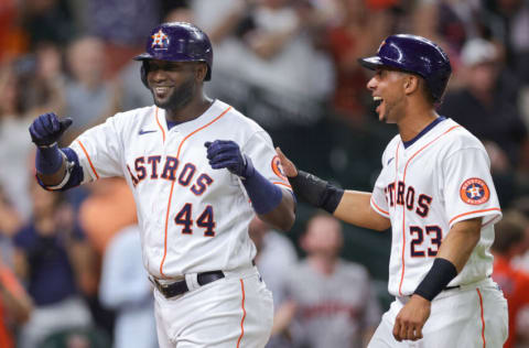 HOUSTON, TEXAS - JUNE 07: Yordan Alvarez #44 of the Houston Astros celebrates with Michael Brantley #23 after hitting a two run home during the eighth inning against the Seattle Mariners at Minute Maid Park on June 07, 2022 in Houston, Texas. (Photo by Carmen Mandato/Getty Images)