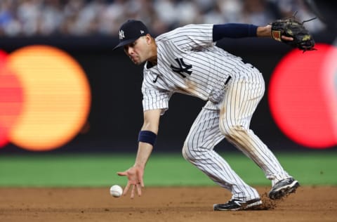 NEW YORK, NEW YORK - JUNE 14: Isiah Kiner-Falefa #12 of the New York Yankees barehands a ball before recording an out during the seventh inning of the game against the Tampa Bay Rays at Yankee Stadium on June 14, 2022 in New York City. (Photo by Dustin Satloff/Getty Images)