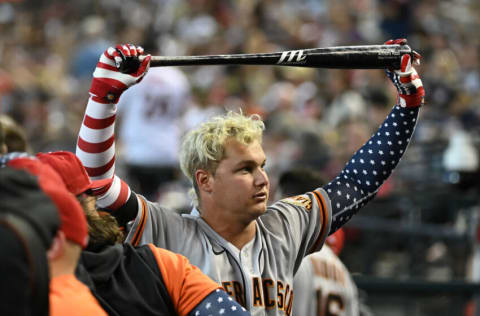 PHOENIX, ARIZONA - JULY 04: Joc Pederson #23 of the San Francisco Giants warms up standing in the dugout in the fifth inning against the Arizona Diamondbacks at Chase Field on July 04, 2022 in Phoenix, Arizona. (Photo by Norm Hall/Getty Images)