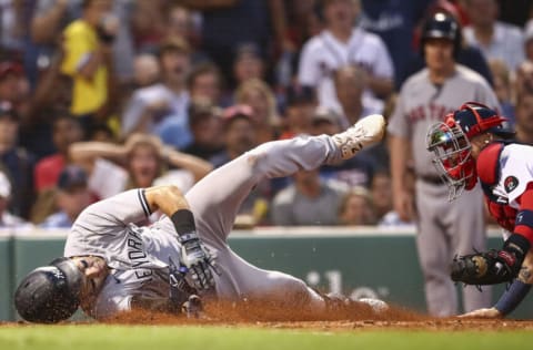 BOSTON, MA - JULY 08: Joey Gallo #13 of the New York Yankees is tagged out at home plate by Christian Vazquez #7 of the Boston Red Sox as he attempts to score an in-the-park home run in the third inning of a game at Fenway Park on July 8, 2022 in Boston, Massachusetts. (Photo by Adam Glanzman/Getty Images)