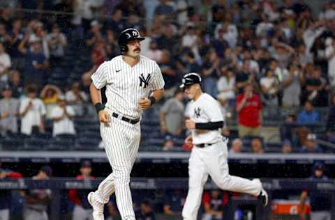 NEW YORK, NEW YORK - JULY 16: Matt Carpenter #24 of the New York Yankees is walked the the bases loaded as Anthony Rizzo #48 score a run on the play against the Boston Red Sox at Yankee Stadium on July 16, 2022 in the Bronx borough of New York City. The New York Yankees defeated the Boston Red Sox 14-1. (Photo by Elsa/Getty Images)