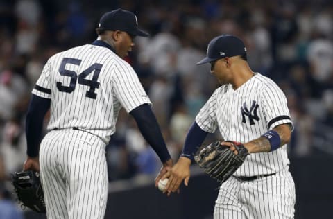 NEW YORK, NEW YORK - AUGUST 02: Aroldis Chapman #54 and Gleyber Torres #25 of the New York Yankees celebrate after defeating the Boston Red Sox at Yankee Stadium on August 02, 2019 in New York City. (Photo by Jim McIsaac/Getty Images)