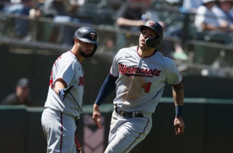 OAKLAND, CALIFORNIA - MAY 18: Carlos Correa #4 of the Minnesota Twins celebrates with Gary Sanchez #24 after scoring against the Oakland Athletics at RingCentral Coliseum on May 18, 2022 in Oakland, California. (Photo by Lachlan Cunningham/Getty Images)