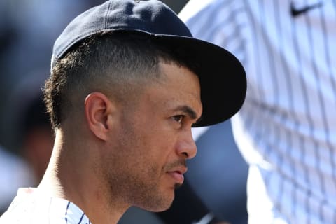 NEW YORK, NY – JULY 30: Giancarlo Stanton #27 of the New York Yankees watches from the dugout during a game against the Kansas City Royals at Yankee Stadium on July 30, 2022 in New York City. (Photo by Rich Schultz/Getty Images)