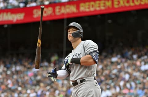 SEATTLE, WASHINGTON - AUGUST 10: Aaron Judge #99 of the New York Yankees tosses his bat before walking to first base during the third inning against the Seattle Mariners at T-Mobile Park on August 10, 2022 in Seattle, Washington. (Photo by Alika Jenner/Getty Images)