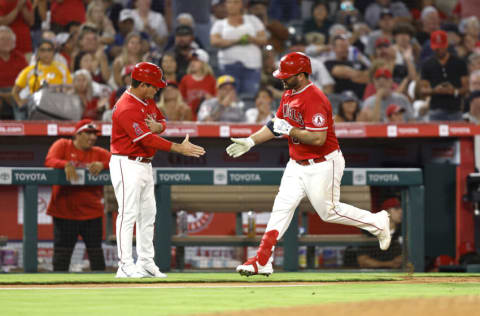 ANAHEIM, CALIFORNIA - AUGUST 29: Mike Ford #36 of the Los Angeles Angels celebrates his solo home run with third base coach Mike Gallego #86 against the New York Yankees in the fourth inning at Angel Stadium of Anaheim on August 29, 2022 in Anaheim, California. (Photo by Michael Owens/Getty Images)